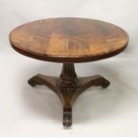 A CIRCULAR 19TH CENTURY ROSEWOOD TABLE, standing on a triform platform base, having scrolled feet.