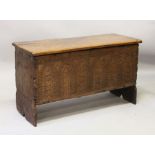 A 19TH CENTURY OAK BOARDED COFFER, with carved decoration, (later top). 3ft 1ins wide x 1ft 9ins
