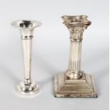 A SINGLE FLOWER VASE with loaded base, 5.5ins high, Birmingham 1915; and A CORINTHIAN COLUMN