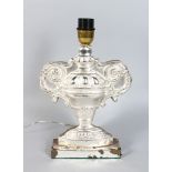 A SILVER GILT LAMP.