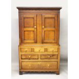 A 19TH CENTURY OAK CUPBOARD ON CHEST, with a pair of panelled doors above three dummy drawers, two