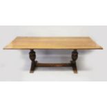 A GOOD OAK REFECTORY TABLE with four plank plain top, carved end cup and cover supports, with