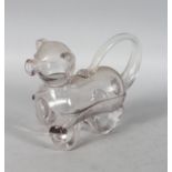 A GLASS NOVELTY DECANTER IN THE FORM OF A DOG.