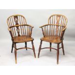 AN 18TH CENTURY WINDSOR ELM AND OAK ARMCHAIR with crinoline stretcher.
