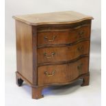 A GEORGE III STYLE MAHOGANY SMALL SERPENTINE BACHELORS CHEST, with brushing slide, three long