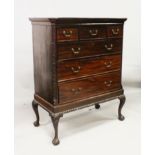 A GEORGE III MAHOGANY CHEST IN LATER STAND, with a dentil cornice, three short and three graduated