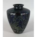 A LOETZ STYLE IRIDESCENT BLUE VASE. 7.5ins high.