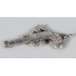 A SILVER PISTOL SHAPE WHISTLE.