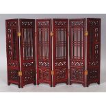 A CHINESE PIERCED WOOD SIX FOLD TABLE SCREEN, each fold 9.75in x 2.5in.