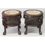 A PAIR OF FINE QUALITY 19TH CENTURY CHINESE PINK MARBLE TOP CARVED HARDWOOD STANDS, each pierced and