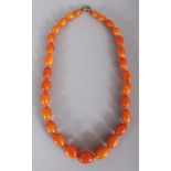 ANOTHER GOOD QUALITY AMBER EGG BUTTERSCOTCH NECKLACE, weighing approx. 40gm, with a gilt-metal