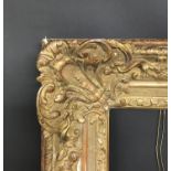 20th Century Dutch School. A Carved Giltwood Frame with Swept Centres and Corners, 45" x 33.25" (