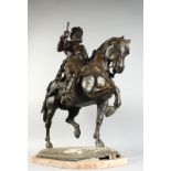 A GOOD LARGE BRONZE OF A NOBLEMAN, wearing armour and sitting on his horse. 35ins high x 29ins