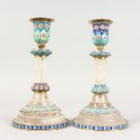 A GOOD PAIR OF RUSSIAN SILVER, CHAMPLEVE ENAMEL AND CRYSTAL CANDLESTICKS. 7.5ins high.