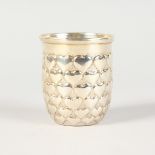 A CHRISTIAN DIOR SILVER CUP, decorated with bands of hearts. Stamped .925. 3ins high.