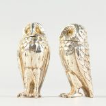 A SMALL PAIR OF .925 SILVER OWL SALT AND PEPPERS. 2ins high.