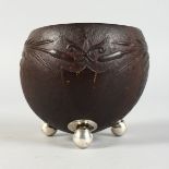 A GOOD 19TH CENTURY CARVED COCONUT BOWL, carved with an eagle, bulrushes and a vacant shield shape