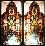 A GOOD PAIR OF 19TH CENTURY STAINED AND PAINTED WINDOW PANELS of pointed arched shape, decorated