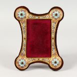 A RUSSIAN SILVER AND CHAMPLEVE ENAMEL SHAPED PHOTOGRAPH FRAME. 9.5ins x 7ins.