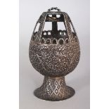 A SMALL UNUSUAL 19TH CENTURY INDIAN EMBOSSED SILVER-METAL CONTAINER, weighing approx. 51gm, the