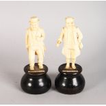 A PAIR OF EUROPEAN CARVED IVORY FIGURES OF MR PICKWICK and CAPT. CUTTLE. 3.5ins high, on turned