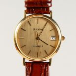 A GENTLEMAN'S GOLD BULOVA WRISTWATCH, with leather strap.