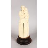 A 19TH CENTURY EUROPEAN CARVED IVORY MOTHER AND CHILD, the body opens to reveal a triptych, Christ