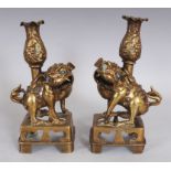AN UNUSUAL PAIR OF TIBETAN OR NEPALESE POLISHED BRONZE JOSS STICK HOLDERS, 19th Century or