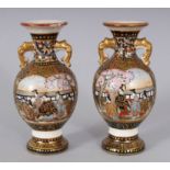 A SMALL PAIR OF JAPANESE SATSUMA TWO-HANDLED VASES, painted with figures in reverse panels. 3.5ins