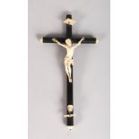 A CARVED IVORY CRUCIFIX on an ebony cross. 9ins long.