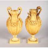 A GOOD PAIR OF 18TH CENTURY EUROPEAN CARVED IVORY VASES, carved with fruiting garlands. 4.5ins