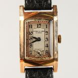 A GENTLEMAN'S KENDAL & DENT EDWARDIAN WRISTWATCH with leather strap.