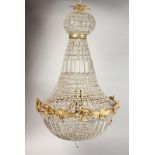 A CUT GLASS AND ORMOLU CHANDELIER. 39ins high.