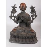 A LARGE BRONZE SEATED BUDDHA, hands together, on a lotus base. 14ins high.