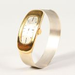 A LADIES 18K GOLD BRACELET TYPE COLLYWOOD WATCH.