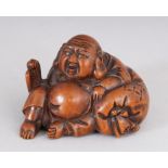 A JAPANESE CARVED WOOD ""HOTEI"" NETSUKE.