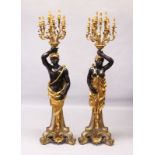 A PAIR OF BLACKAMOOR FLOOR STANDING NINE LIGHT CANDELABRA. 7ft 0ins high.