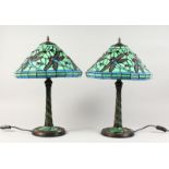 A PAIR OF TIFFANY STYLE GREEN GLASS DRAGONFLY TABLE LAMPS. 22ins high.