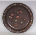 A JAPANESE MEIJI PERIOD MIXED METAL CIRCULAR DISH, on three bun feet, the interior decorated with