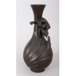 A JAPANESE BRONZE VASE, with a flower in relief. Signed. 9.5ins high.