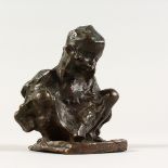 A SMALL CAST BRONZE OF A CHILD sitting cross legged. 4.5ins high.