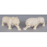 A PAIR OF EARLY 20TH CENTURY JAPANESE CARVED IVORY MODELS OF LIONS, each prowling forward, 4.3in &