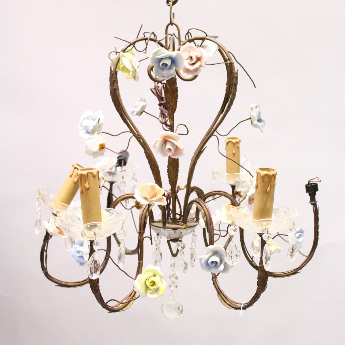 A GILT METAL AND PORCELAIN SIX BRANCH CHANDELIER, with porcelain rosebud decoration. 1ft 10ins