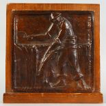 AN ARTS & CRAFTS COPPER PLAQUE, embossed with a man harvesting corn, signed G. VIOLET, framed. 10ins