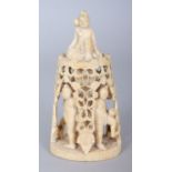 AN EARLY 20TH CENTURY BURMESE PIERCED IVORY GROUP, carved with a group of acolytes surrounding a