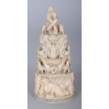 AN UNUSUAL 19TH CENTURY GOANESE CARVED IVORY GROUP, depicting Mary reclining with a book before a