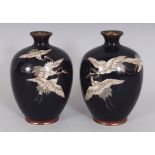 A PAIR OF JAPANESE MEIJI PERIOD MIDNIGHT BLUE CLOISONNE VASES, each decorated with a group of cranes