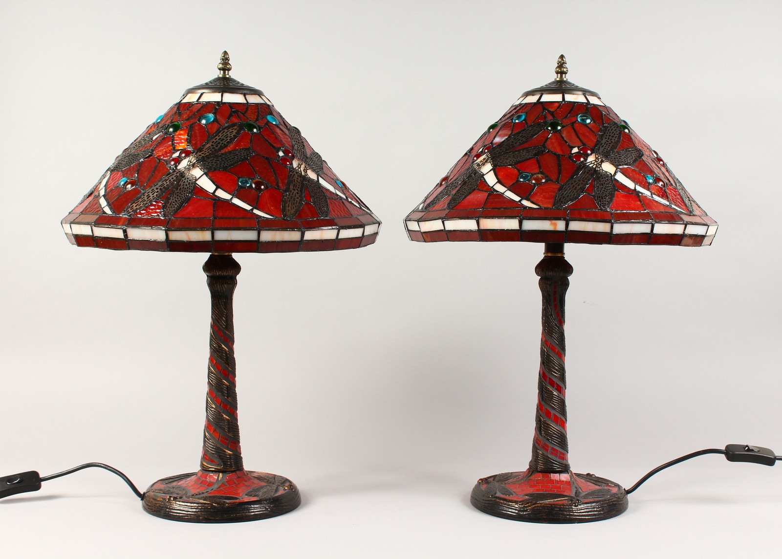 A PAIR OF TIFFANY STYLE RED GLASS DRAGONFLY TABLE LAMPS. 22ins high.