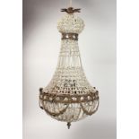 A CUT GLASS AND ORMOLU CHANDELIER. 29ins high.