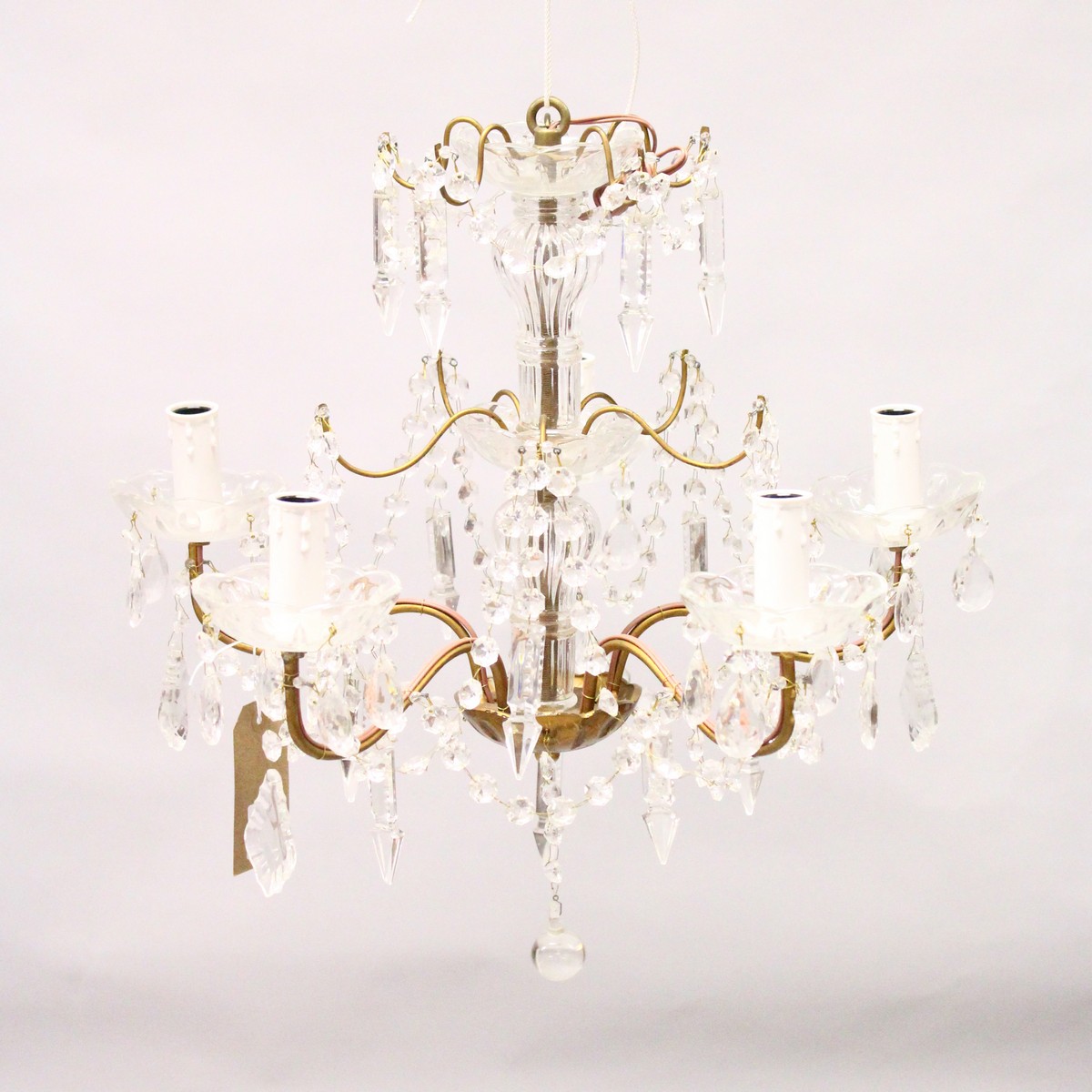 A CUT GLASS FIVE BRANCH CHANDELIER, with prism cut drops. 1ft 6ins high x 1ft 8ins wide.